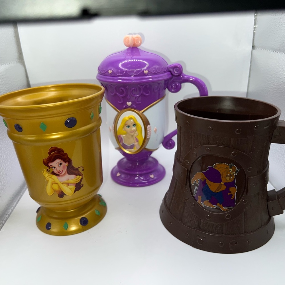 Set of 3 Disney park souvenir cups featuring Belle, Rapunzel, and the Beast